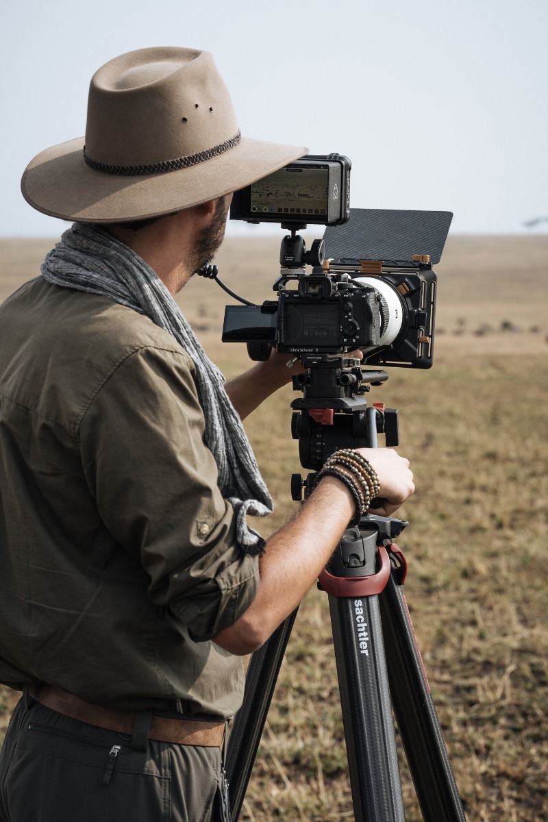 Chris-Schmid-sony-alpha-7RM4-chris-framing-a-shot-on-his-alpha-camera-mounted-on-a-tripod