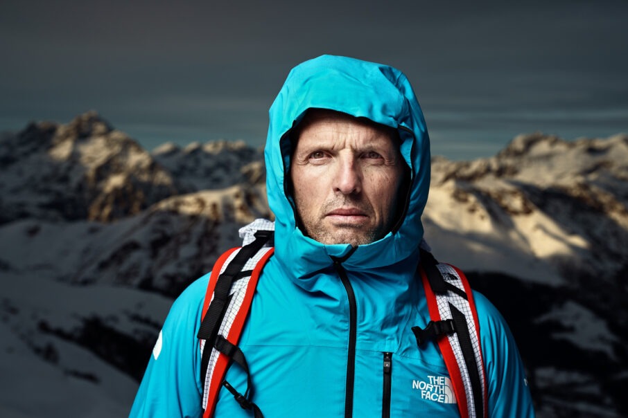 man-wearing-a-blue-coat-on-top-of-a-mountain_wresized_w906