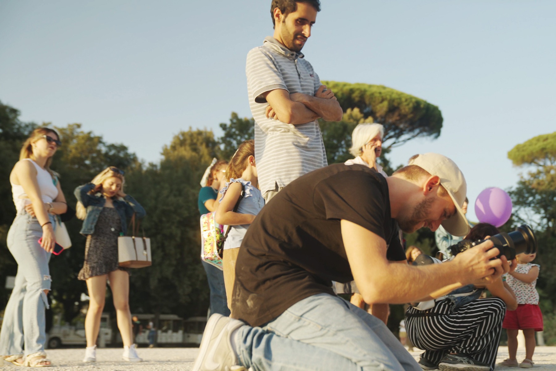 matteo-bruno-crouching-down-as-he-frames-a-shot-on-his-sony-alpha-camera