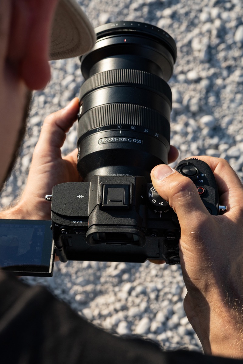 matteo-bruno-looking-at-the-lcd-screen-on-his-sony-a7m4