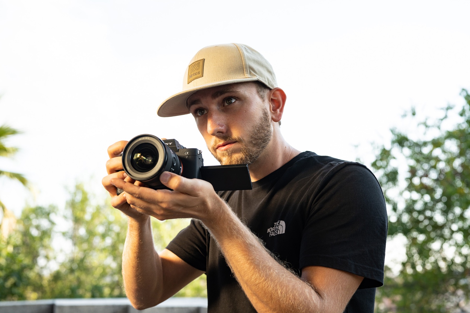 matteo-bruno-looking-up-as-he-frames-a-shot-on-his-sony-a7m4