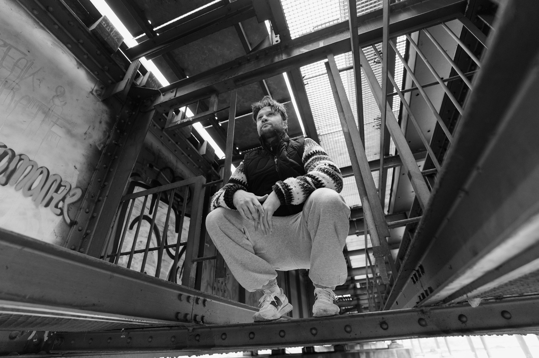 parkour-athlete-crouching-down-looking-pensive